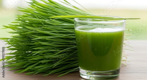 Fresh Green Wheatgrass and Juice Arranged on Wooden Table Outdoors