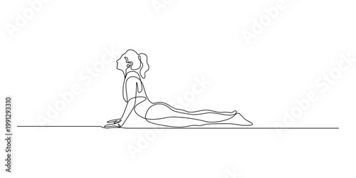 Woman performing cobra pose in yoga with exercise wellness meditation flexibility strength movement practice