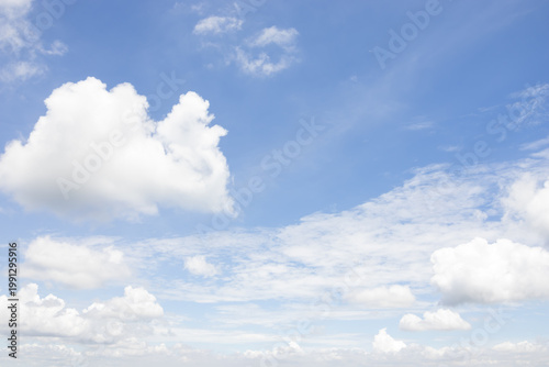 sky was bright blue, with white clouds drifting gently by, creating  calm and serene atmosphere.