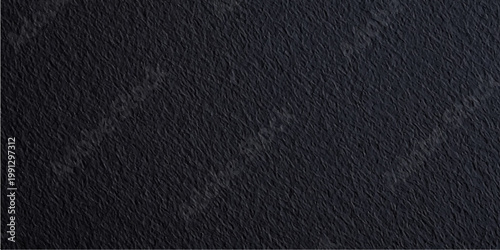 A luxury black leather texture showcases a dark macro pattern on a rough natural surface, creating a sophisticated textile backdrop with a detailed grey material structure for a textured wallpaper