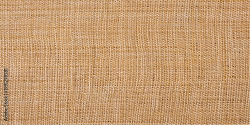 Natural linen and brown woven mat textile texture with a rough burlap fiber pattern and macro sackcloth material backdrop