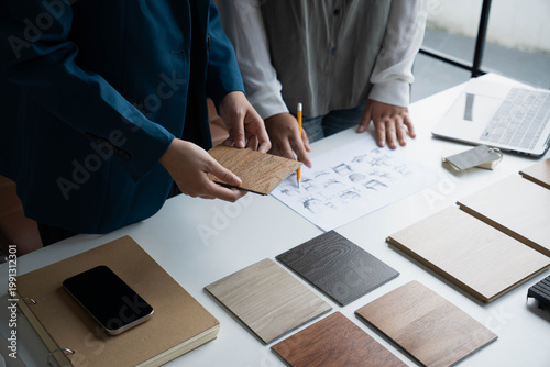 Quadro su tela Interior Designer Consulting with Client on Material Selection