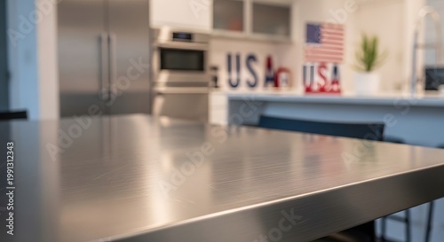 Modern stainless steel table with blurred professional American Kitchen Background for product mockup .