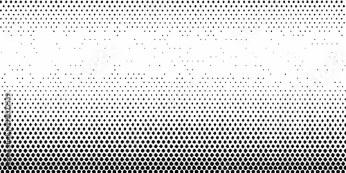 Gradual halftone dot pattern transitioning from dense to sparse