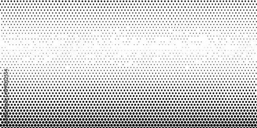 Abstract halftone pattern transitioning from dense to sparse dots