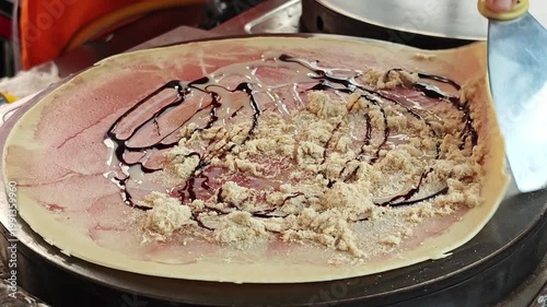 Thai style crepe on hot pan. Dried Shredded Pork and Blueberry Jam.