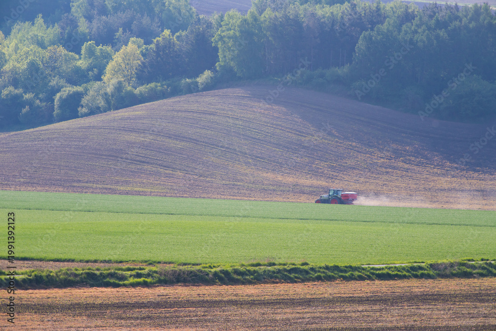 Obraz premium Tractor working on the field in Moravia