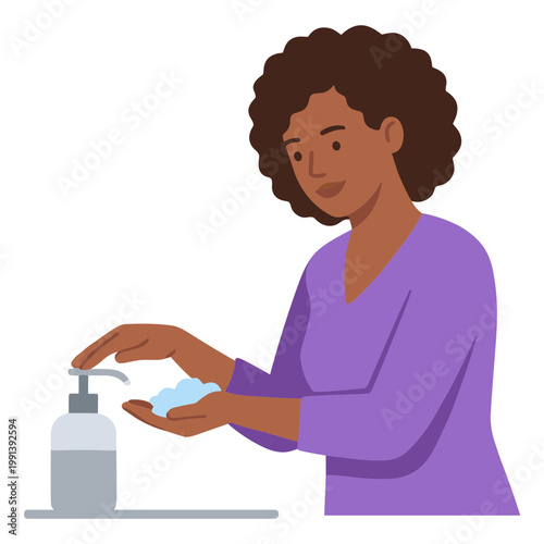 A woman applies hand sanitizer in a public place with a dispenser.