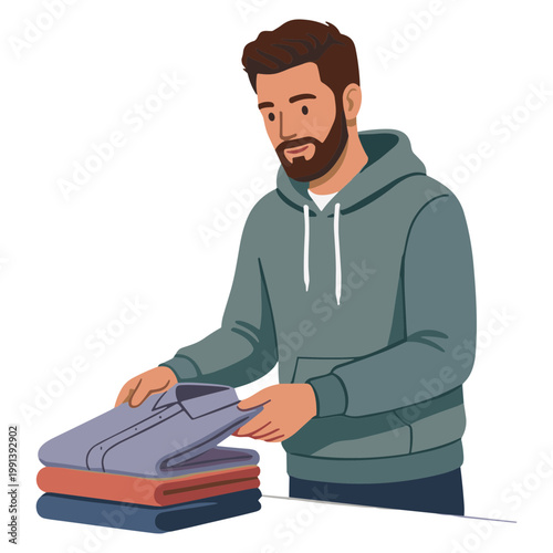 Man folding clothes on a table in a casual setting