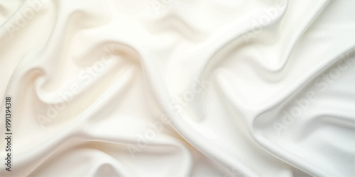 Elegant white silk and satin fabric background featuring smooth luxury textile waves with a soft shiny drapery texture and rippled curves for a fashion backdrop