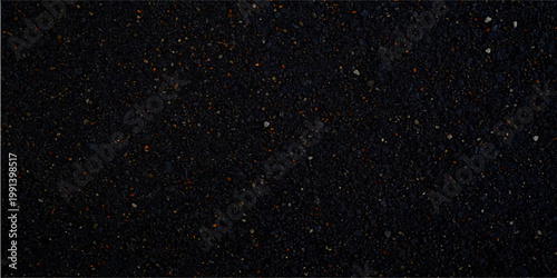 Abstract rain drops on a black window create a dark cosmos of white snowflakes and blue starlight resembling a cold nebula across the night sky universe