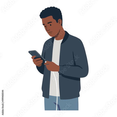 A man is looking at his smartphone while standing indoors.