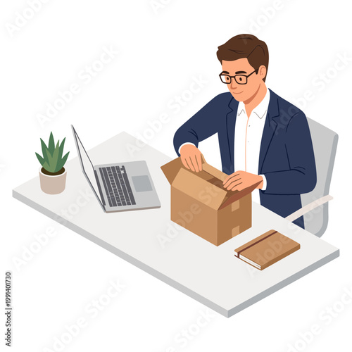 Man unpacking cardboard box on office desk with laptop and notebook