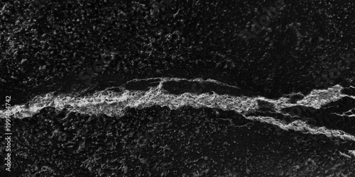 Bild auf Leinwand High-contrast black and white grunge texture of cracked cement