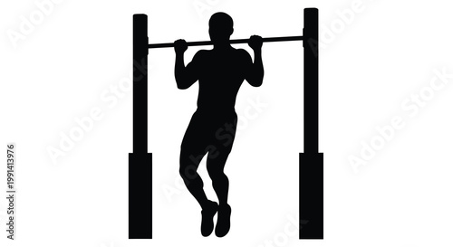 Silhouette of a man performing a pull up exercise on a bar