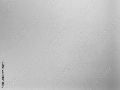 Monochrome texture of shiny grained glass. Abstract background for design.