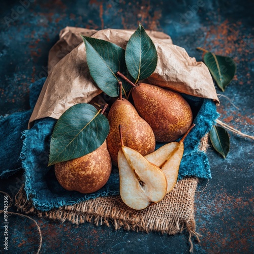 Freshly picked pears with green leaves in a rustic setting