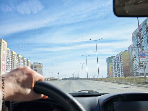 Obraz na plátně Driving on an open road in spring while enjoying a solo travel adventure