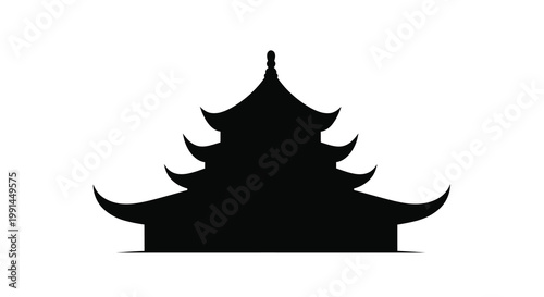 Silhouetted traditional asian pagoda with multiple tiers and curved roofs