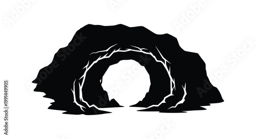 A dark silhouetted mountain with a glowing cave entrance