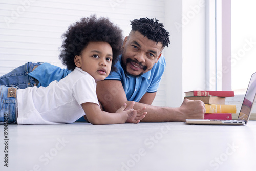 African father is teaching his son