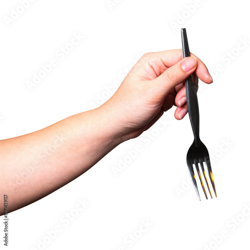 Female hand holding a silver fork isolated on white background with a clipping path.