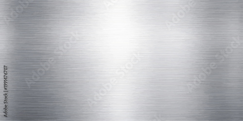 A polished stainless steel plate featuring a brushed metal texture on a shiny silver aluminum surface provides a sleek industrial metallic pattern with a smooth grey titanium material reflection
