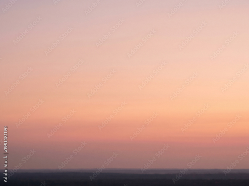 Obraz premium Serene Sky's Gradient Canvas: Witness the artistry of nature as the sky transitions through soft hues, creating a mesmerizing gradient canvas of colors. A moment of pure tranquility.