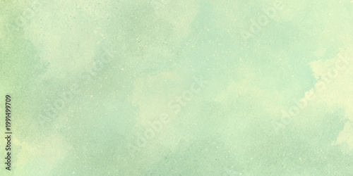 Soft green watercolor background with subtle texture and pastel hues for design