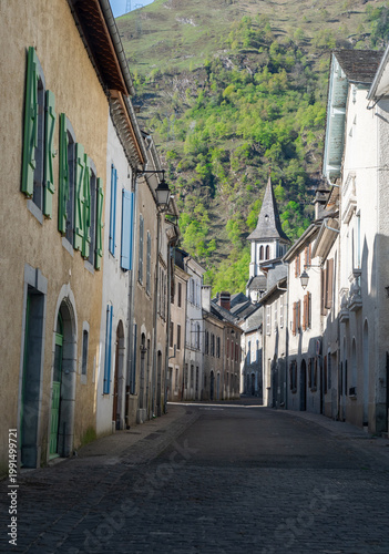Alley and bell tower of the church of Laruns, Pyrenees Atlantiques, France