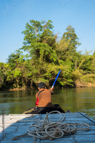Bamboo rafting in the tropical forest of Kanchanaburi, Thailand.