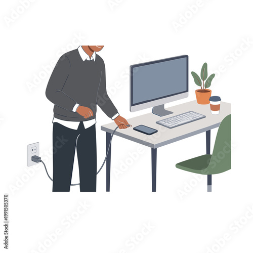A man works on a computer plugged into a socket.