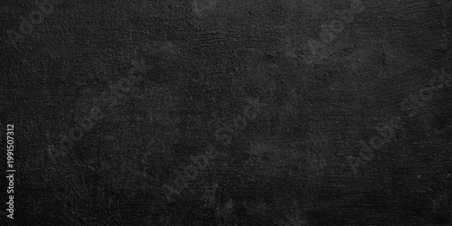Dark gray wall or black textured background with rough surface for design and decoration