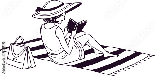 Woman relaxing on a striped beach towel reading a book with a hat and handbag nearby.