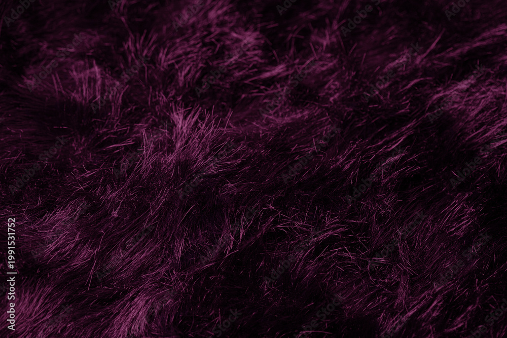 Obraz premium Close up view of dark purple shaggy faux fur textile fabric texture providing cozy abstract background
