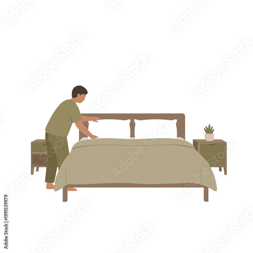 Man making bed with comforter and pillows in bedroom with nightstand