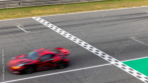 Motion blur, Race car racing on speed track, race car on road crossing start and finish line, Target business achieve and victory concept.
