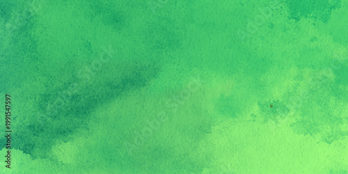 Vibrant green watercolor background with soft gradient texture and abstract brushstrokes for creative design projects and artistic applications