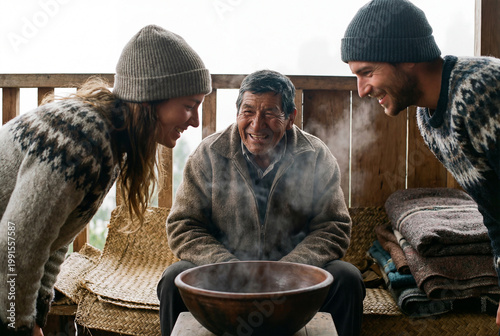 People enjoying a steaming drink together during a social pause around a rustic indoor table with cozy welcoming warmth