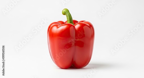 Vibrant red bell pepper isolated against white background for culinary use