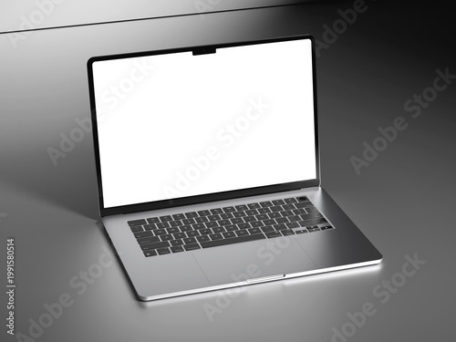 Angled view of a modern silver laptop with white screen and black keyboard on gray.