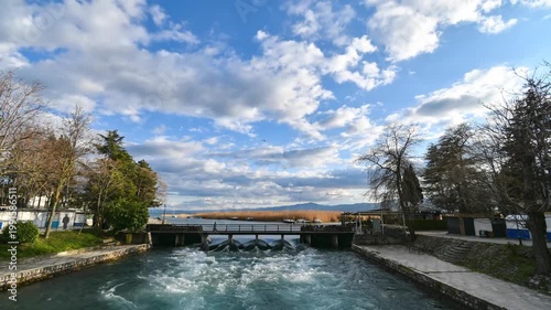 Time-lapse video of the movement of clouds above the place where the waters of the Crn Drim River flow out of Lake Ohrid, under the wooden bridge. Most popular place in Struga, Macedonia.