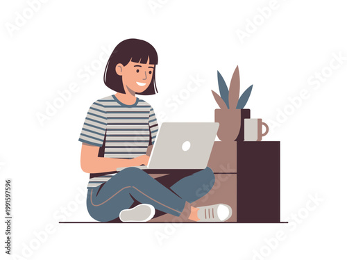 A young woman sitting cross-legged while using a laptop.
