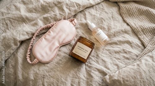 Relaxation essentials sleep mask and aromatherapy oil on cozy bedding