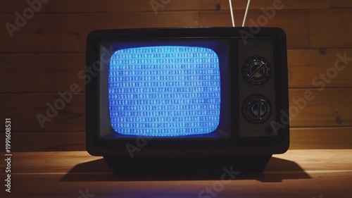 Vintage Television in living room with wooden background. 
