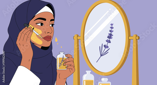 A beautiful woman wearing a blue hijab carefully applies a nourishing yellow face serum using a glass dropper in front of a mirror in her bedroom.