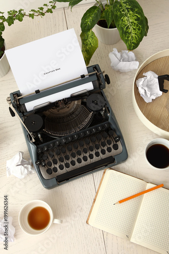 Vintage typewriter, cups of...