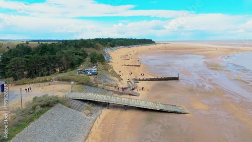Wells Next to the Sea Beach. Sand dunes where Norfolk Coast path with beach huts and tourist beaches. Beach huts on the promenade at Gorleston-on-sea in Norfolk, UK