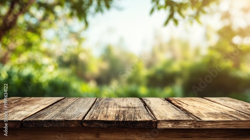 Wooden table with blurred green foliage background nature setting