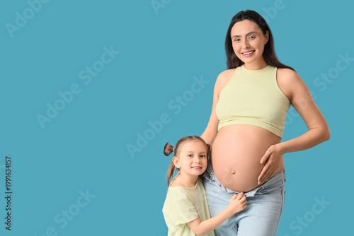 Happy pregnant woman and he...